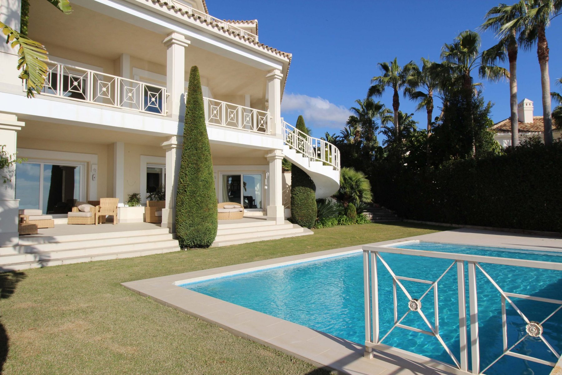 Pool terrace and shaded outdoor lounge